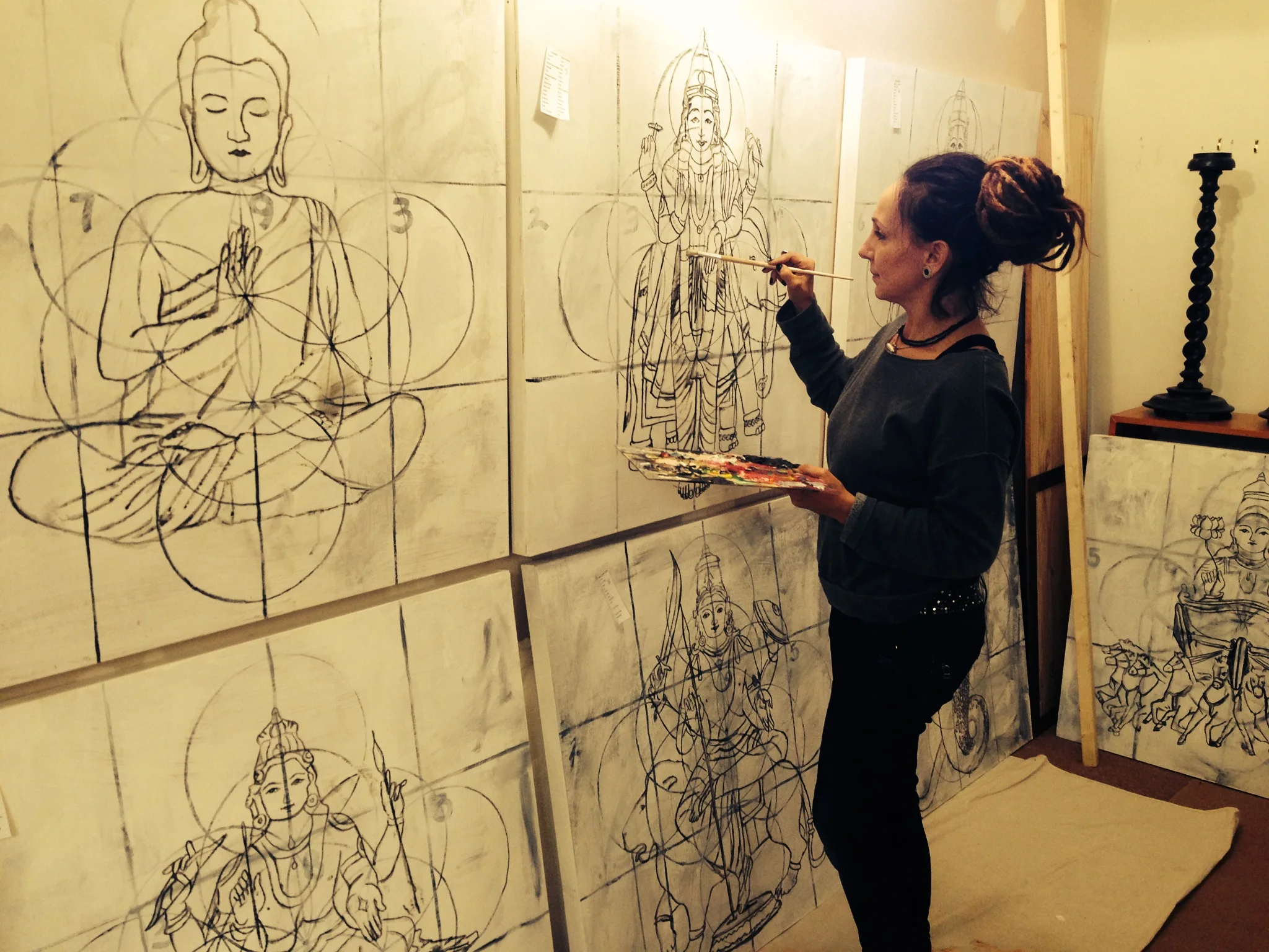 Jayashri Triolo painting large-scale spiritual figures in her Cazadero studio